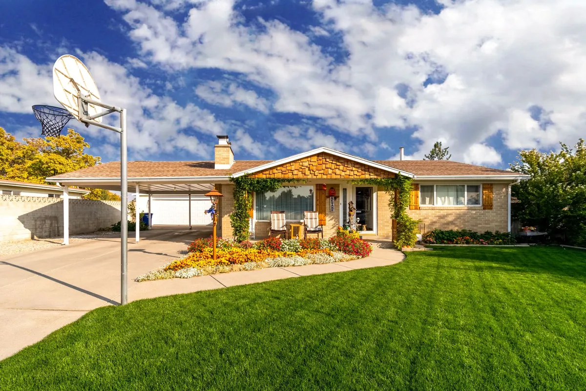Illustrative stock photograph of a suburban home with a lawn.